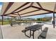 Community picnic pavilion with tables and benches overlooking a pond at 648 Cortona Dr, Orlando, FL 32828