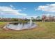 Scenic pond with fountain and gazebo in community at 648 Cortona Dr, Orlando, FL 32828