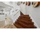 Modern staircase with dark wood steps and white railing at 648 Cortona Dr, Orlando, FL 32828