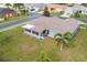 Aerial view of a single-Gathering home with a large backyard and screened-in porch at 707 Terranova Ave, Winter Haven, FL 33884