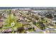 An aerial view of a residential neighborhood with houses and a lake at 707 Terranova Ave, Winter Haven, FL 33884