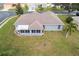 Aerial view showing a single-Gathering house with a backyard and surrounding neighborhood at 707 Terranova Ave, Winter Haven, FL 33884