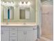Updated bathroom showcases dual sinks, ample counter space, modern lighting, and a glass-enclosed shower at 707 Terranova Ave, Winter Haven, FL 33884
