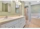 Well-appointed bathroom features double sinks, a soaking tub, a separate shower, and ample storage at 707 Terranova Ave, Winter Haven, FL 33884
