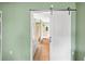 Bathroom with a large soaking tub and sliding barn door at 707 Terranova Ave, Winter Haven, FL 33884