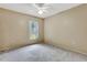 Empty bedroom featuring neutral carpet, a ceiling fan, and ample natural light at 707 Terranova Ave, Winter Haven, FL 33884