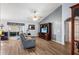 Spacious living room with vaulted ceiling, gray walls, and a large TV at 707 Terranova Ave, Winter Haven, FL 33884