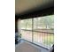 Relaxing screened balcony with a view of green trees and outdoor scenery at 8203 Olympia Ct # 8203, Longwood, FL 32779