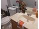 Bathroom with toilet, sink, and a decorative towel at 8203 Olympia Ct # 8203, Longwood, FL 32779