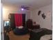 Bedroom with a bed, beanbag chair, TV and skull decor at 8203 Olympia Ct # 8203, Longwood, FL 32779