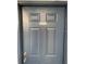 Gray front door with a simple design and numbered address at 8203 Olympia Ct # 8203, Longwood, FL 32779