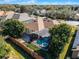 Aerial view of a house with a pool and screen enclosure at 8231 Lynch Dr, Orlando, FL 32835