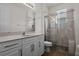 Bathroom featuring a walk-in shower and modern vanity at 8231 Lynch Dr, Orlando, FL 32835