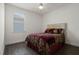 Bedroom with a queen bed, wood-look floors, and ceiling fan at 8231 Lynch Dr, Orlando, FL 32835