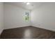 Well lit bedroom with wood-look tile floor and window at 8231 Lynch Dr, Orlando, FL 32835