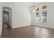 Formal dining room with tile floors, chandelier and large windows at 8231 Lynch Dr, Orlando, FL 32835