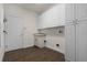 Laundry room with white cabinets and ample storage at 8231 Lynch Dr, Orlando, FL 32835