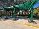 Covered picnic area with tables and benches under a pergola at 8513 Crystal Cove Loop, Kissimmee, FL 34747