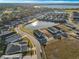 Aerial view of community with lake at 8575 Hempstead Way, Mount Dora, FL 32757