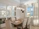 Dining room with mirror accent wall and farmhouse style table at 8575 Hempstead Way, Mount Dora, FL 32757