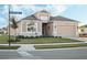 House exterior view with street sign and landscaped front yard at 8575 Hempstead Way, Mount Dora, FL 32757