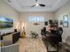 Home office features built-in desk and ample natural light at 8575 Hempstead Way, Mount Dora, FL 32757