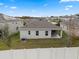 Aerial view of house, backyard, and surrounding homes at 9653 Early Loop, Groveland, FL 34736