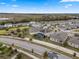 Aerial view of a house with pool and solar panels in a residential community at 9653 Early Loop, Groveland, FL 34736