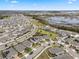 Aerial view of a neighborhood near a lake at 9653 Early Loop, Groveland, FL 34736