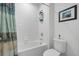 Clean bathroom with shower/tub combo and white tile at 9653 Early Loop, Groveland, FL 34736