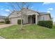 One story house with a two-car garage and landscaping at 9653 Early Loop, Groveland, FL 34736