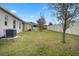 House exterior showcasing fenced backyard and landscaping at 9653 Early Loop, Groveland, FL 34736