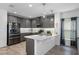 Modern kitchen with gray cabinets and stainless steel appliances at 9653 Early Loop, Groveland, FL 34736