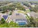 Aerial view highlighting the home's solar panels and pool at 971 Worthington Ct, Oviedo, FL 32765