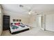 Spacious bedroom with large window, ceiling fan, and private access at 971 Worthington Ct, Oviedo, FL 32765