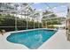 Inviting pool area with screened enclosure, spa, and ample deck space at 971 Worthington Ct, Oviedo, FL 32765