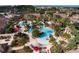 Aerial view showing resort-style pool, landscaping and community buildings at 100 Napoli Dr, Davenport, FL 33897