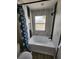 Bathroom with soaking tub, marble tile, and black accents at 100 Napoli Dr, Davenport, FL 33897