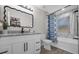 Modern bathroom with white vanity, granite countertop and bathtub at 100 Napoli Dr, Davenport, FL 33897