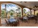 Relaxing community patio with tables and chairs, overlooking a refreshing pool at 100 Napoli Dr, Davenport, FL 33897