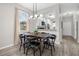 Dining area with dark wood table and black chairs, near kitchen at 100 Napoli Dr, Davenport, FL 33897