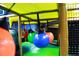 Indoor playground with hanging ball pit at 100 Napoli Dr, Davenport, FL 33897