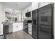 Modern kitchen with stainless steel appliances and white cabinets at 100 Napoli Dr, Davenport, FL 33897