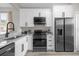 Modern kitchen with stainless steel appliances and granite countertops at 100 Napoli Dr, Davenport, FL 33897