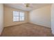 Bright bedroom with carpeted floor and large window at 108 Strait Dr, Davenport, FL 33897