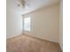 Bedroom with carpet, window with blinds, and ceiling fan at 108 Strait Dr, Davenport, FL 33897