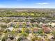 Aerial view of a residential neighborhood with houses and lush greenery at 11016 Orangeshire Ct, Ocoee, FL 34761