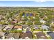 Aerial view of a house near a lake in a residential area at 11016 Orangeshire Ct, Ocoee, FL 34761