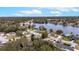 Bird's-eye view of house and surrounding area near a lake at 116 Sheridan Ave, Longwood, FL 32750