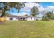 Large backyard with grassy area and home view at 116 Sheridan Ave, Longwood, FL 32750